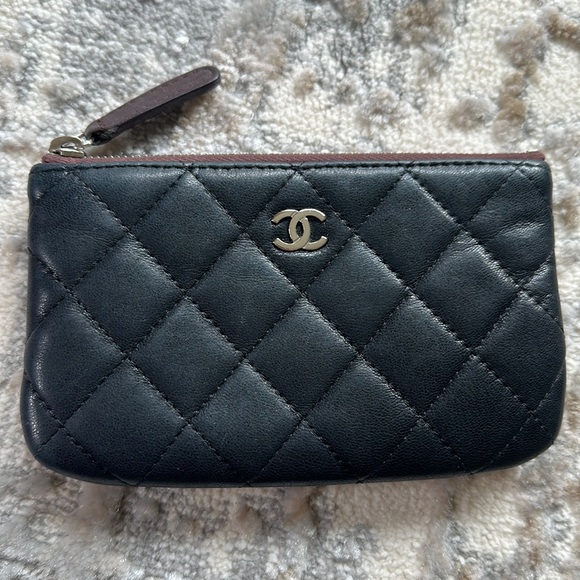 CHANEL Handbags - Chanel Black Quilted Lambskin Leather Small Cosmetic Pouch with Silver Hardware